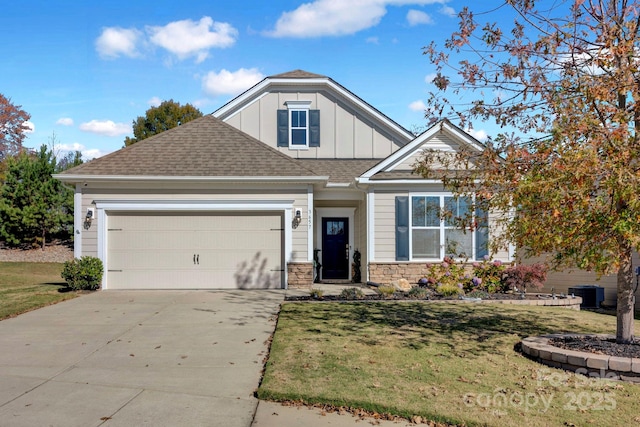 view of front facade with a garage and a front lawn