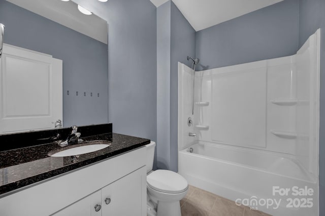 full bathroom with tile patterned flooring, vanity, tub / shower combination, and toilet