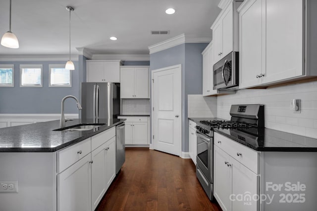 kitchen featuring white cabinetry, sink, and appliances with stainless steel finishes