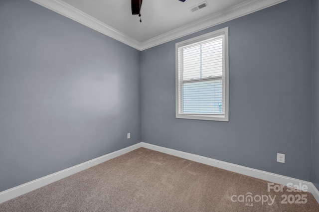 carpeted empty room featuring ornamental molding and ceiling fan