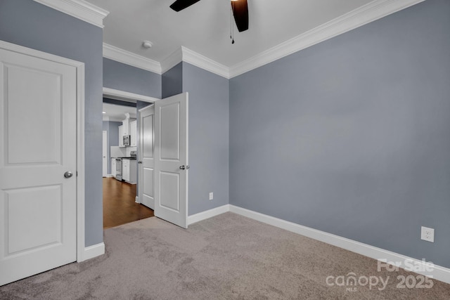 unfurnished bedroom featuring ornamental molding, light colored carpet, and ceiling fan