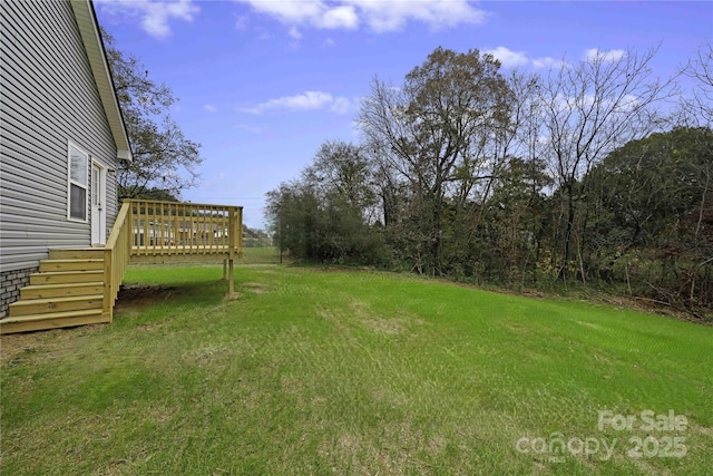 view of yard featuring a deck