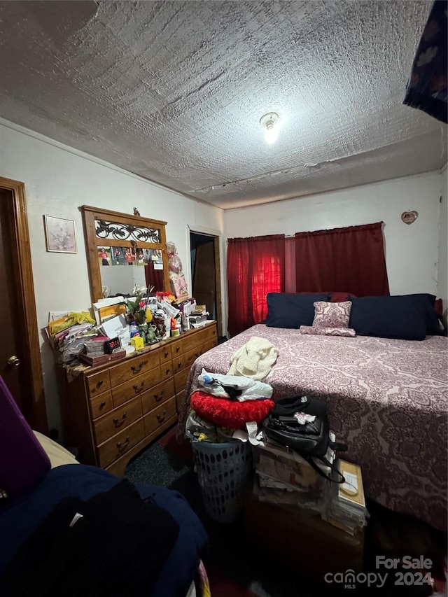 bedroom featuring a textured ceiling