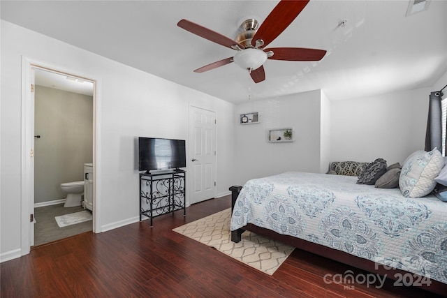 bedroom featuring ceiling fan, dark wood-type flooring, and ensuite bath