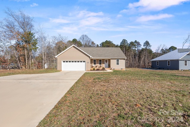 ranch-style house with a garage and a front yard