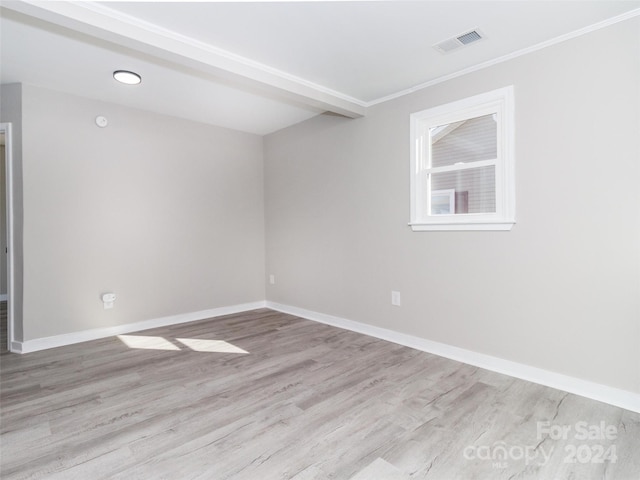 spare room with light hardwood / wood-style flooring