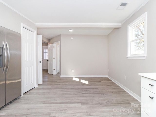 interior space featuring stainless steel fridge with ice dispenser, light wood-type flooring, and ornamental molding