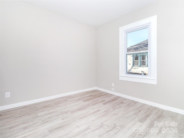 spare room with light hardwood / wood-style floors