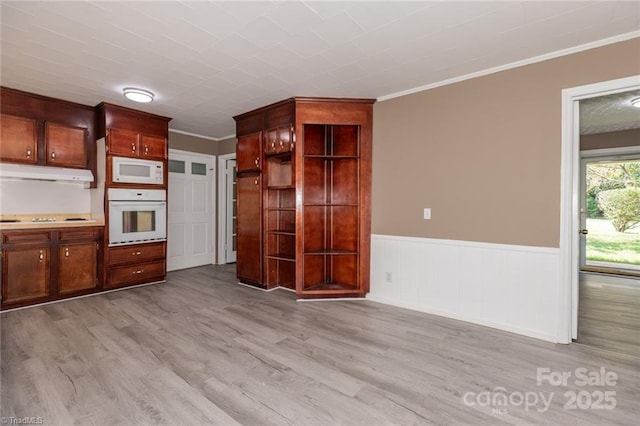 kitchen with crown molding, light hardwood / wood-style flooring, and white appliances