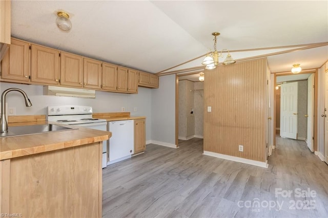 kitchen featuring light brown cabinets, hanging light fixtures, a notable chandelier, vaulted ceiling, and white appliances