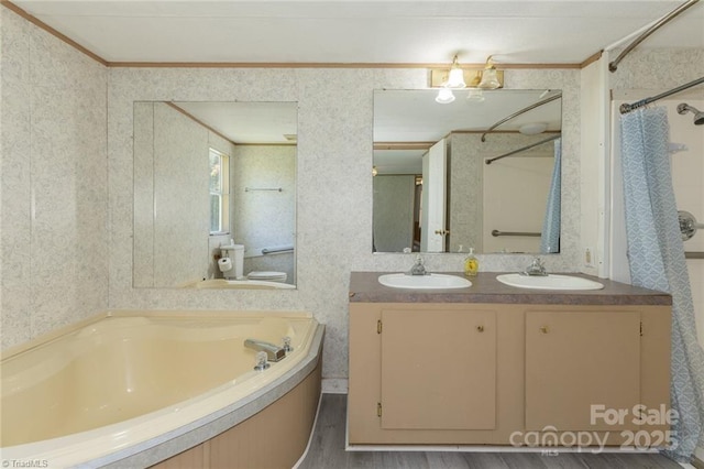 bathroom featuring hardwood / wood-style floors, vanity, shower with separate bathtub, and ornamental molding