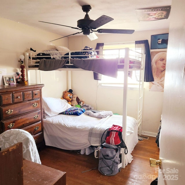 bedroom with wood-type flooring and ceiling fan