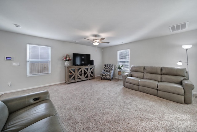 living room with carpet and ceiling fan