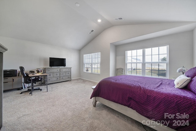 carpeted bedroom featuring vaulted ceiling