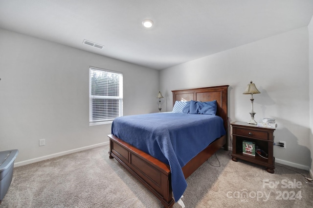 bedroom featuring light carpet