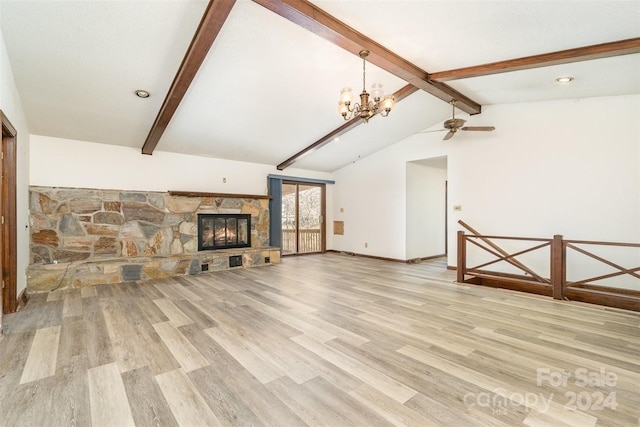 unfurnished living room with a fireplace, lofted ceiling with beams, ceiling fan with notable chandelier, and light hardwood / wood-style flooring