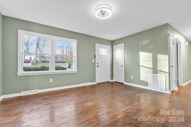 entryway featuring a wealth of natural light and dark hardwood / wood-style flooring