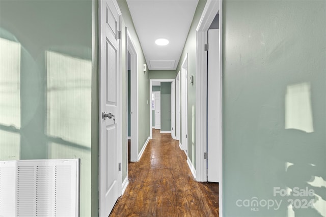 hall with dark wood-type flooring