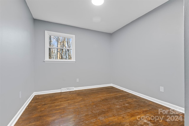 spare room featuring hardwood / wood-style floors