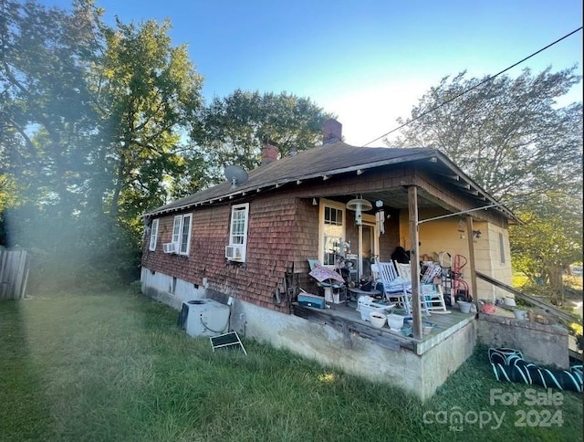 back of property with cooling unit