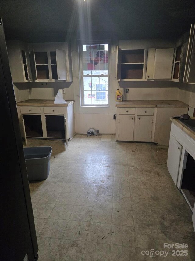 kitchen featuring white cabinetry