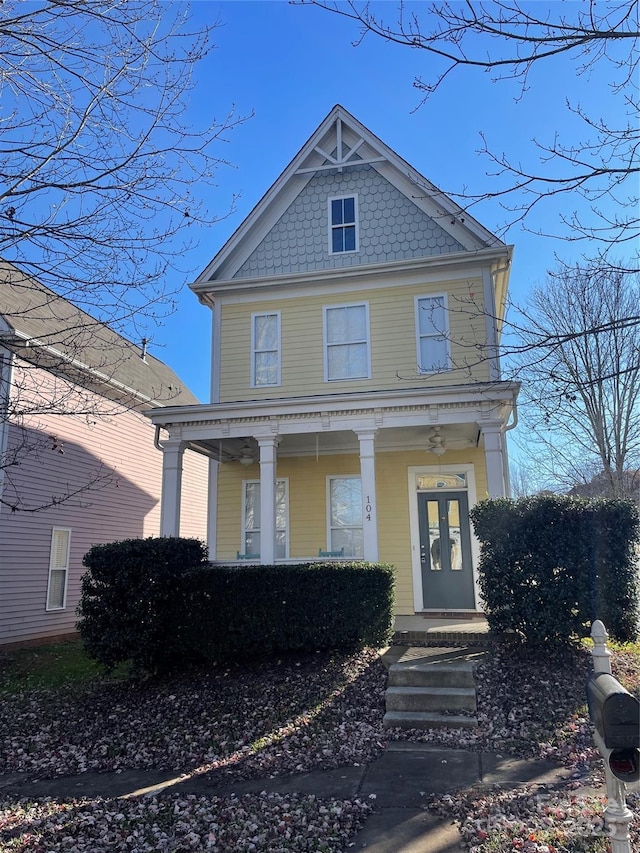 victorian house featuring covered porch