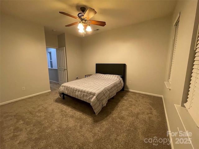 bedroom with ceiling fan and dark colored carpet