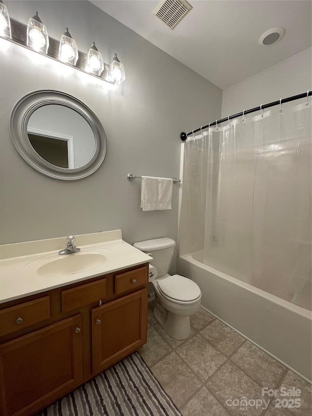 full bathroom with toilet, vanity, and shower / tub combo with curtain