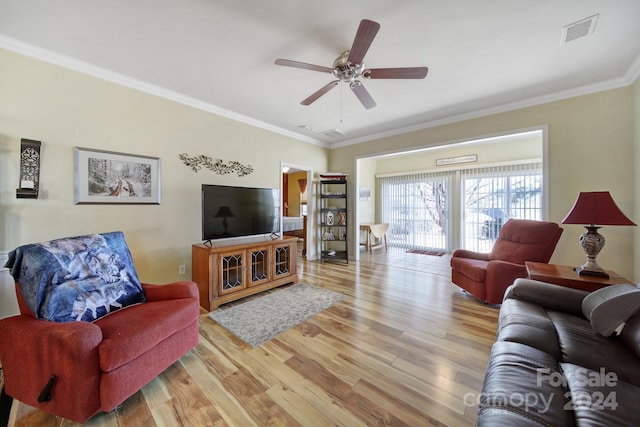 living room featuring crown molding, hardwood / wood-style floors, and ceiling fan