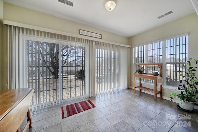 interior space featuring tile patterned floors and plenty of natural light