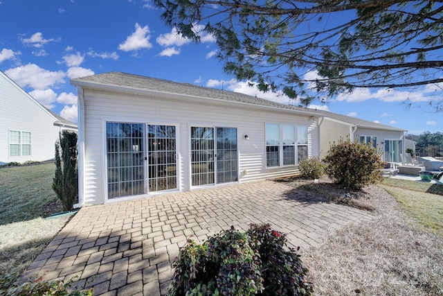 rear view of house featuring a patio area