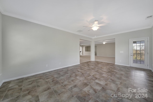 spare room with crown molding and ceiling fan