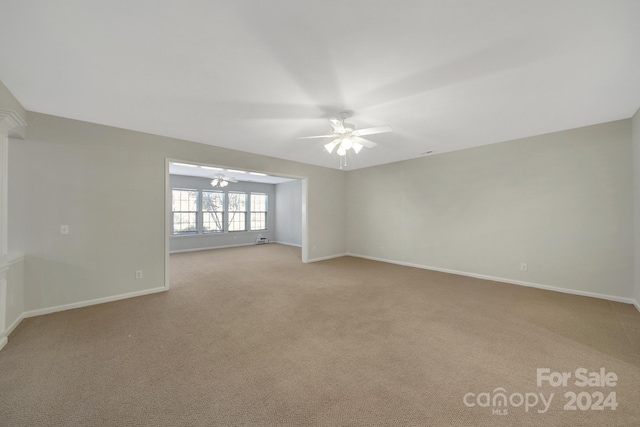 carpeted empty room with ceiling fan