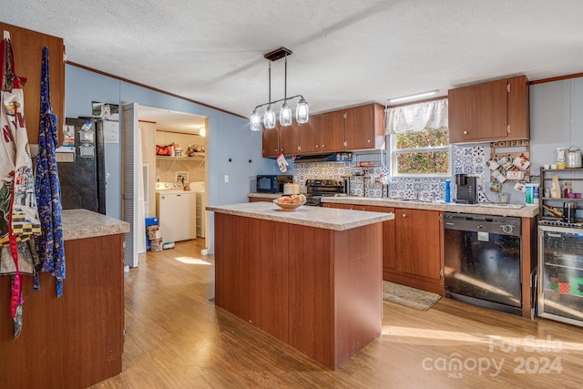 kitchen with black appliances, hanging light fixtures, light hardwood / wood-style flooring, a kitchen island, and beverage cooler