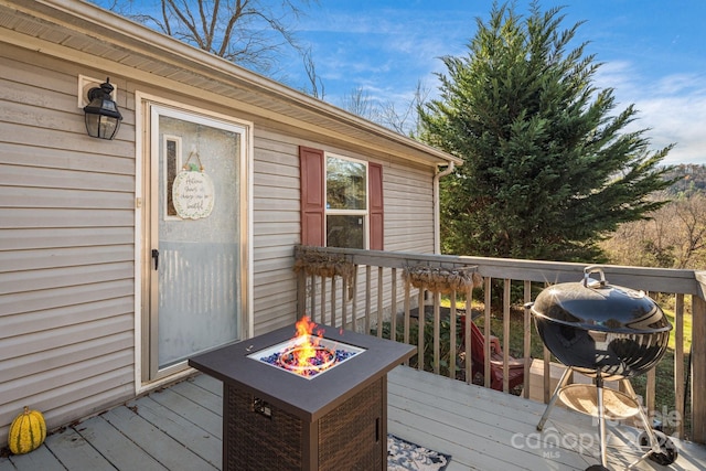 deck featuring a fire pit