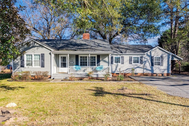 single story home featuring a front lawn and covered porch