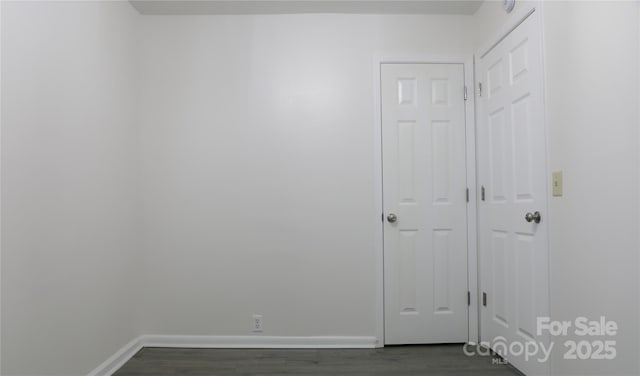 spare room featuring dark hardwood / wood-style flooring