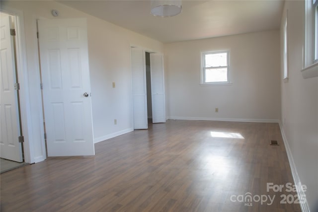 empty room featuring dark hardwood / wood-style floors