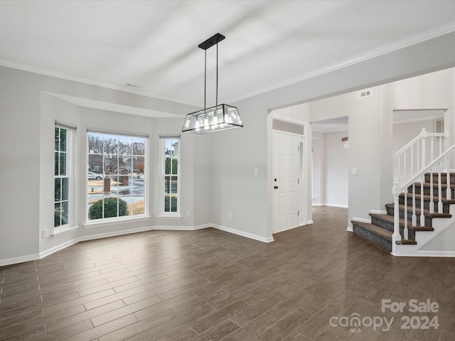 unfurnished dining area featuring crown molding and dark wood-type flooring