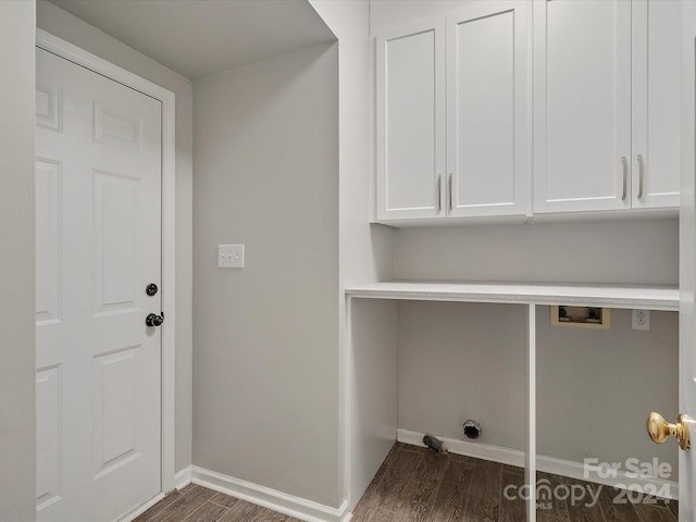 laundry area featuring dark hardwood / wood-style floors, cabinets, and hookup for a washing machine