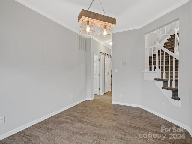 interior space with crown molding and hardwood / wood-style flooring