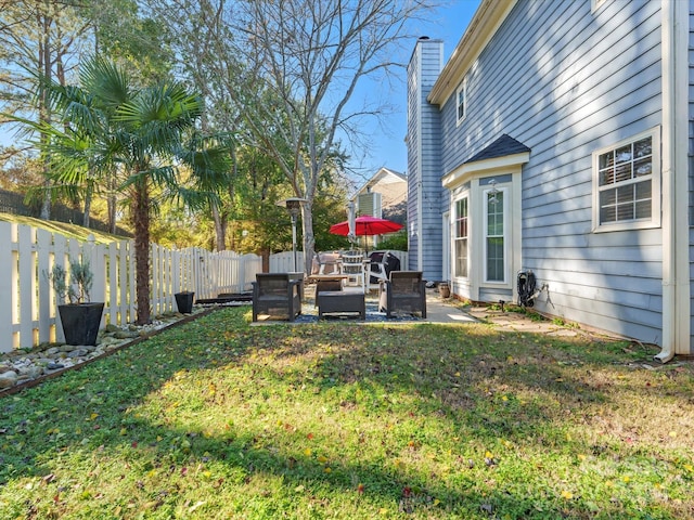 view of yard with an outdoor living space and a patio