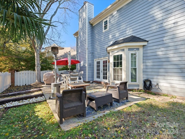 view of patio / terrace with french doors and an outdoor living space