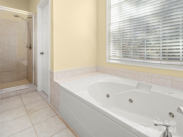 bathroom featuring separate shower and tub and tile patterned floors