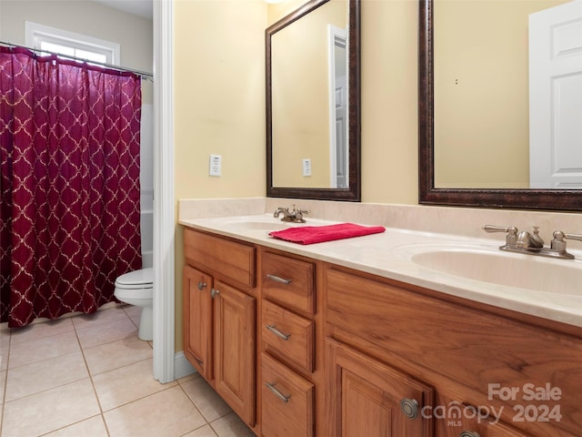 bathroom with tile patterned floors, vanity, and toilet