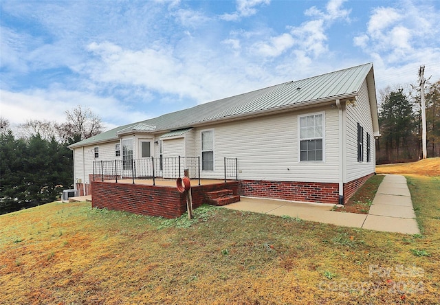 2945 Parks Lafferty Rd, Concord, NC 28025 - back of house featuring a patio, metal roof, a lawn, and central air condition unit
