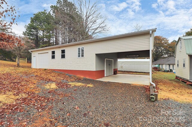 2945 Parks Lafferty Rd, Concord, NC 28025 - view of front facade featuring a garage, an outdoor structure, and a carport