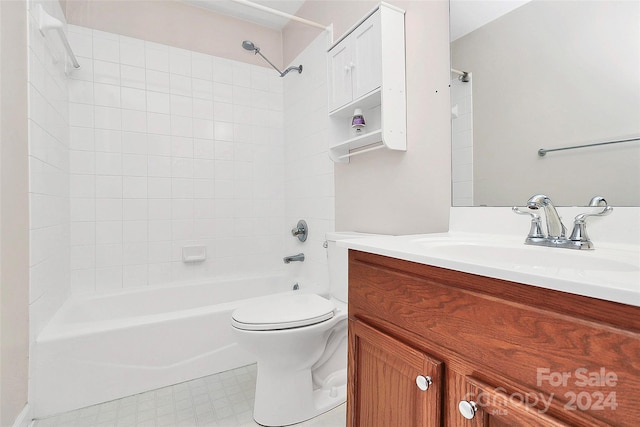 full bathroom featuring vanity, tiled shower / bath combo, and toilet