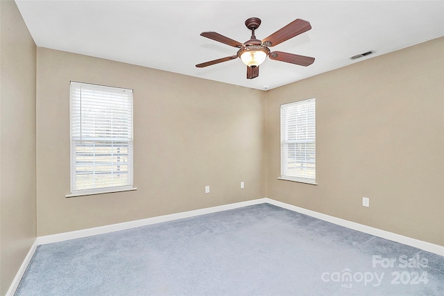 unfurnished room with ceiling fan and carpet floors