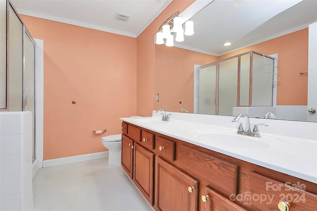 bathroom featuring concrete floors, toilet, vanity, a shower with shower door, and ornamental molding